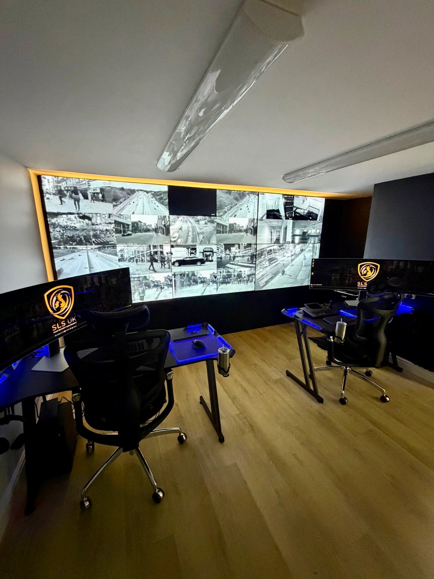 Modern workspace featuring multiple monitors and sleek desks in a minimalist design.